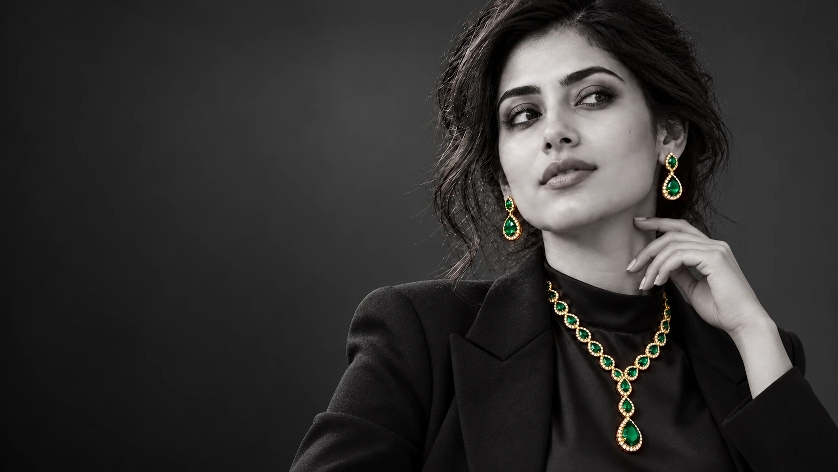 NOIR portrait showcasing emerald earrings and necklace